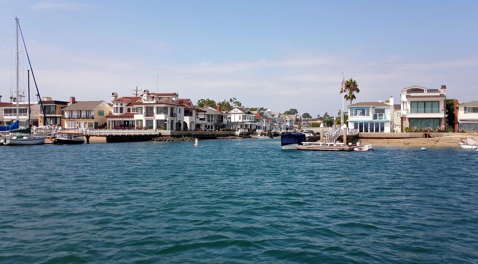 Homes and boats along the Grand Canal in Newport Beach
